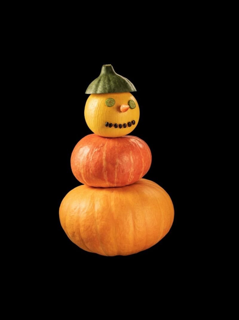 Halloween iPhone wallpaper with mysterious pumpkin on black background